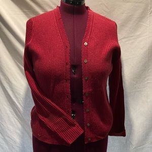 Maroon cardigan.